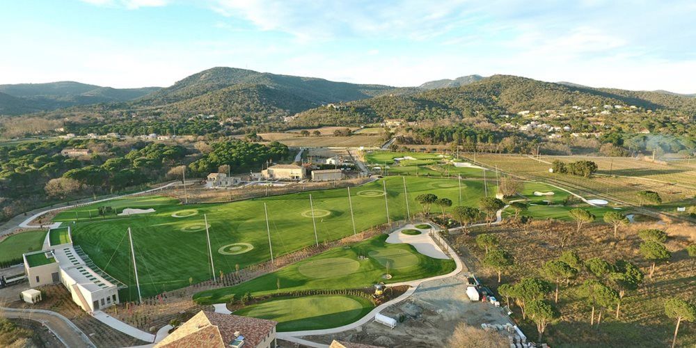 Las Vegas Aerial view of a synthetic grass golf course surrounded by hills