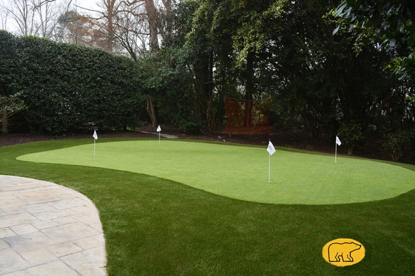 Las Vegas Synthetic grass golf green with 4 holes and flags in a landscaped backyard