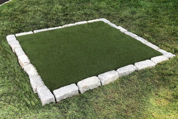 Las Vegas Tee box made of synthetic grass surrounded by stone border