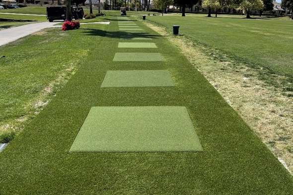 Las Vegas Outdoor tee line with light green synthetic grass boxes inside a dark green synthetic grass strip